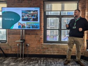 Speaker with presentation at Helping the Helpers event